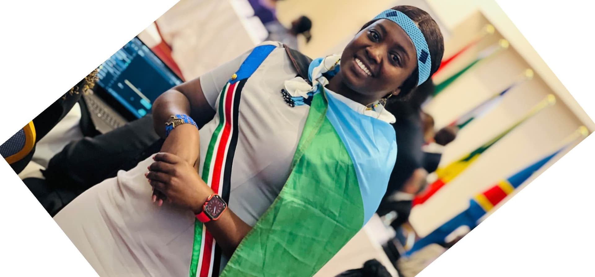 I am wearing my country flag customized dress with the flag on my neck and the traditional beads of my culture.