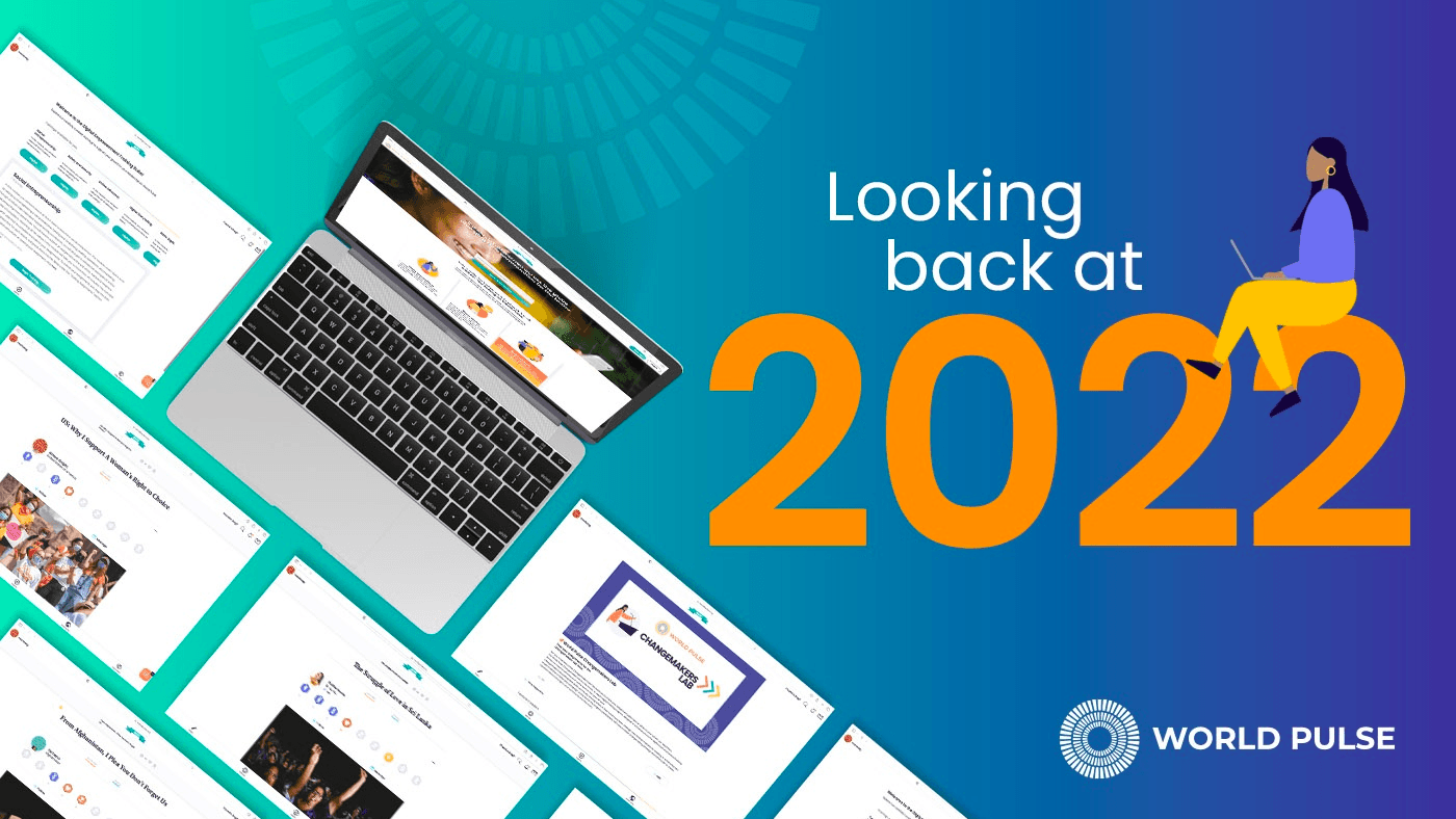 A graphic with the text "Looking back at 2022." Includes an illustration of a woman with a laptop perched on the top of the lettering.